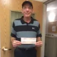 OrthoNY Presents Golfer with Hole-in-One Prize