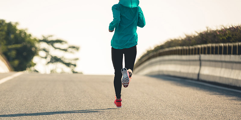 woman running on road